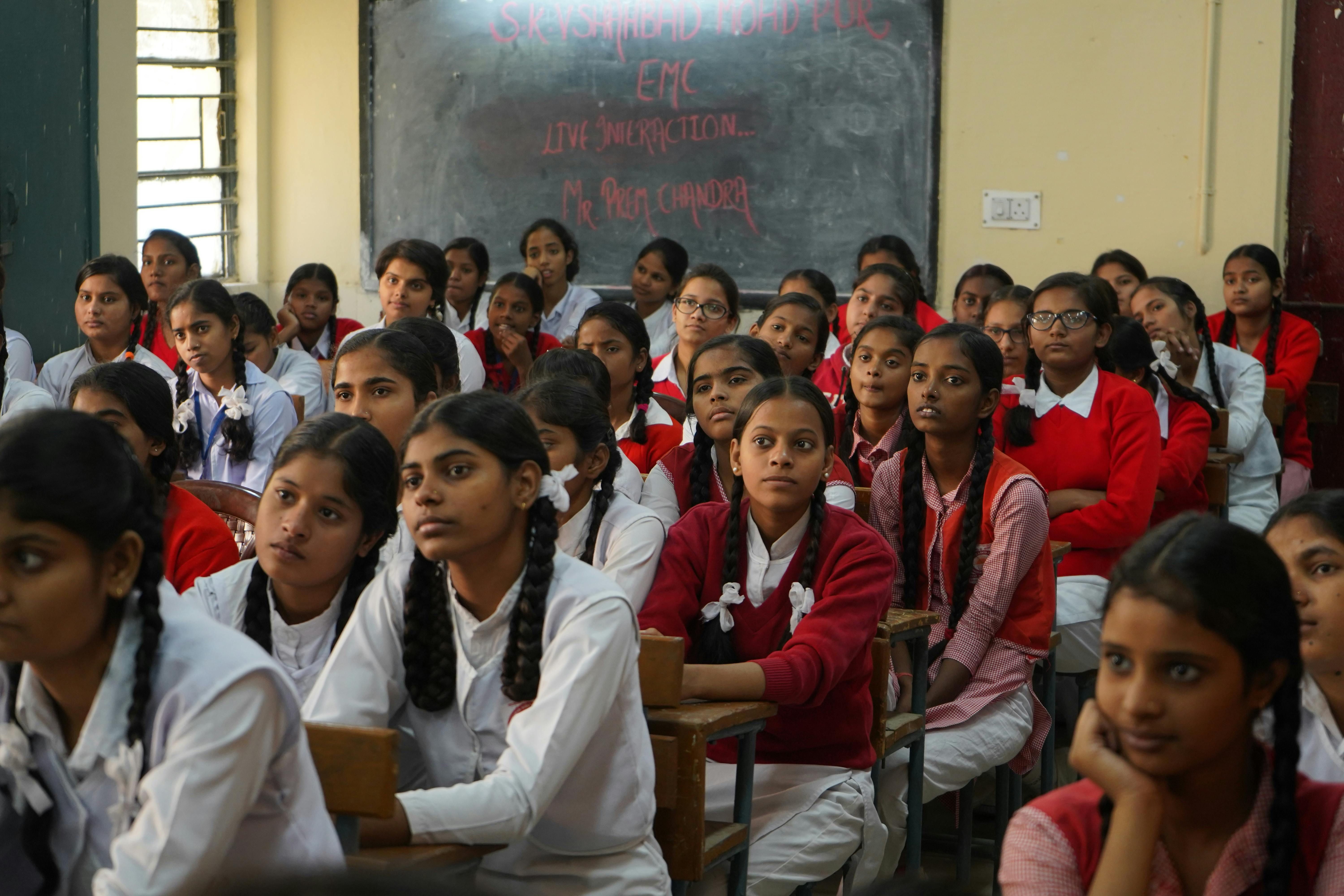 Students engaged in an interactive legal education session, discussing constitutional rights in a modern classroom setting